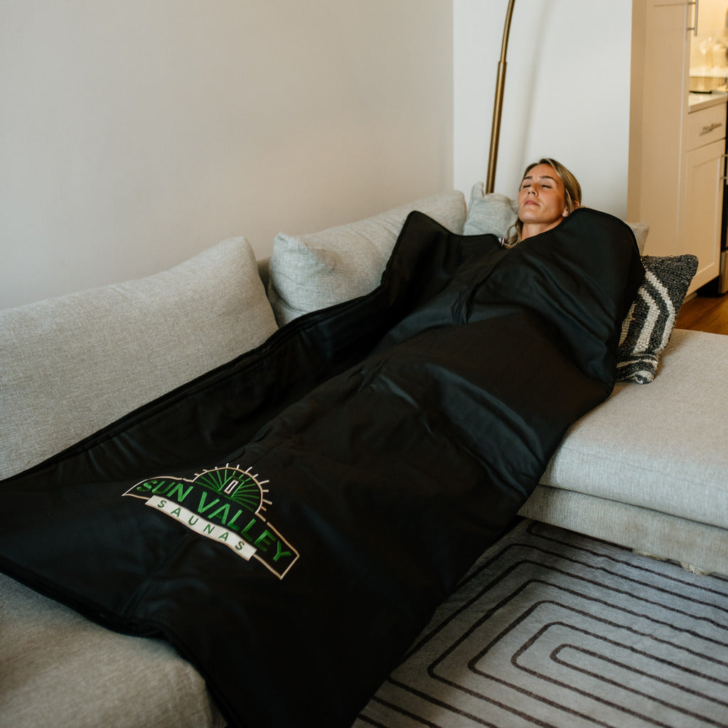 Woman using Sun Valley Saunas Infrared Sauna Blanket