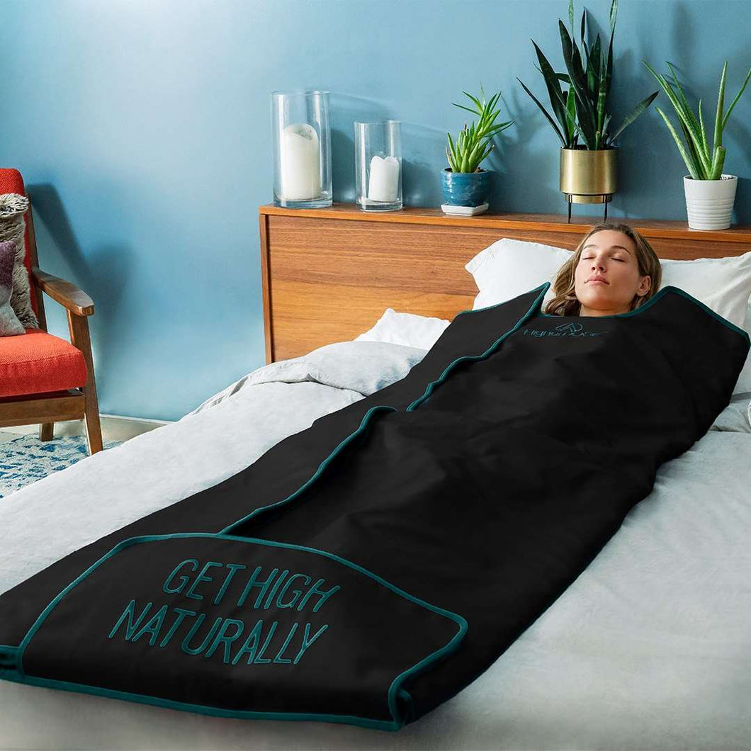 Woman in Infrared Sauna Blanket - Green and Black