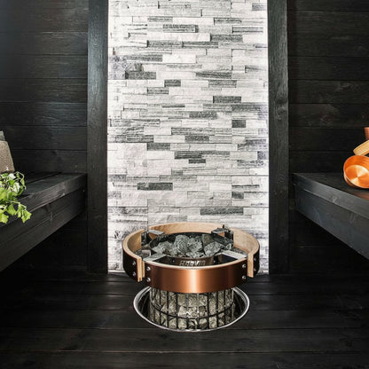 Harvia Cilindro Electric Sauna Heater with safety rail and sauna benches