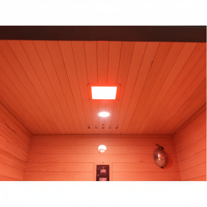 Wooden interior of a sauna with red lighting