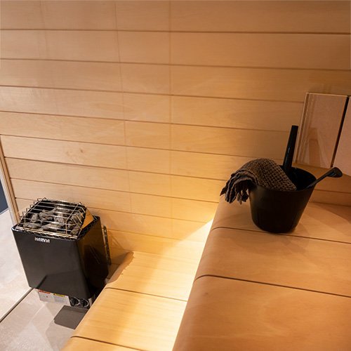 Harvia Kip black heater in a sauna room