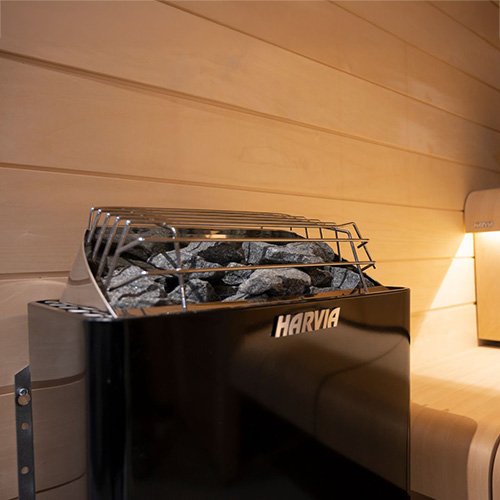 Harvia Kip black electric heater installed in a sauna