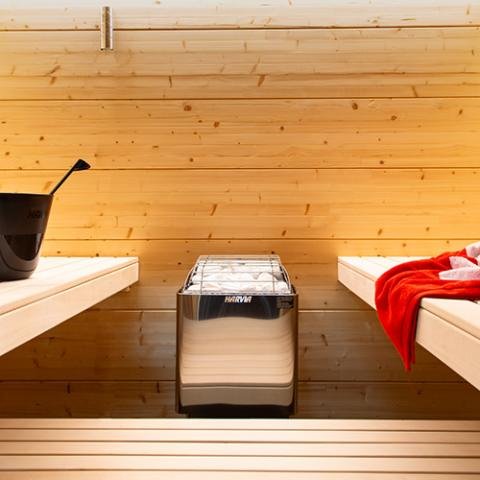 Harvia Kip electric sauna heater in a sauna room