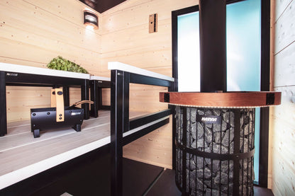 Harvia Legend 240 Duo with wood safety railing in a sauna