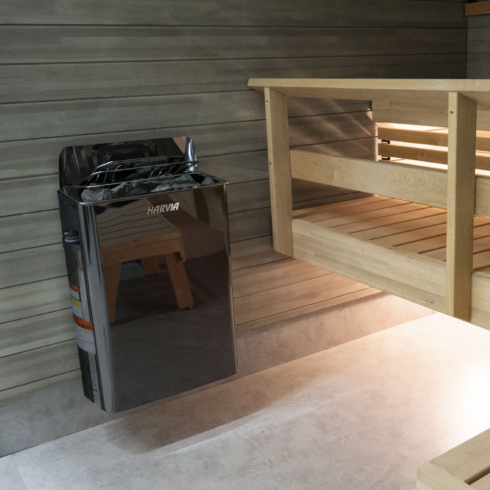 Harvia The Wall black heater mounted on a sauna wall