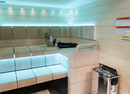 Harvia The Wall heater in a modern sauna with LED bench lighting