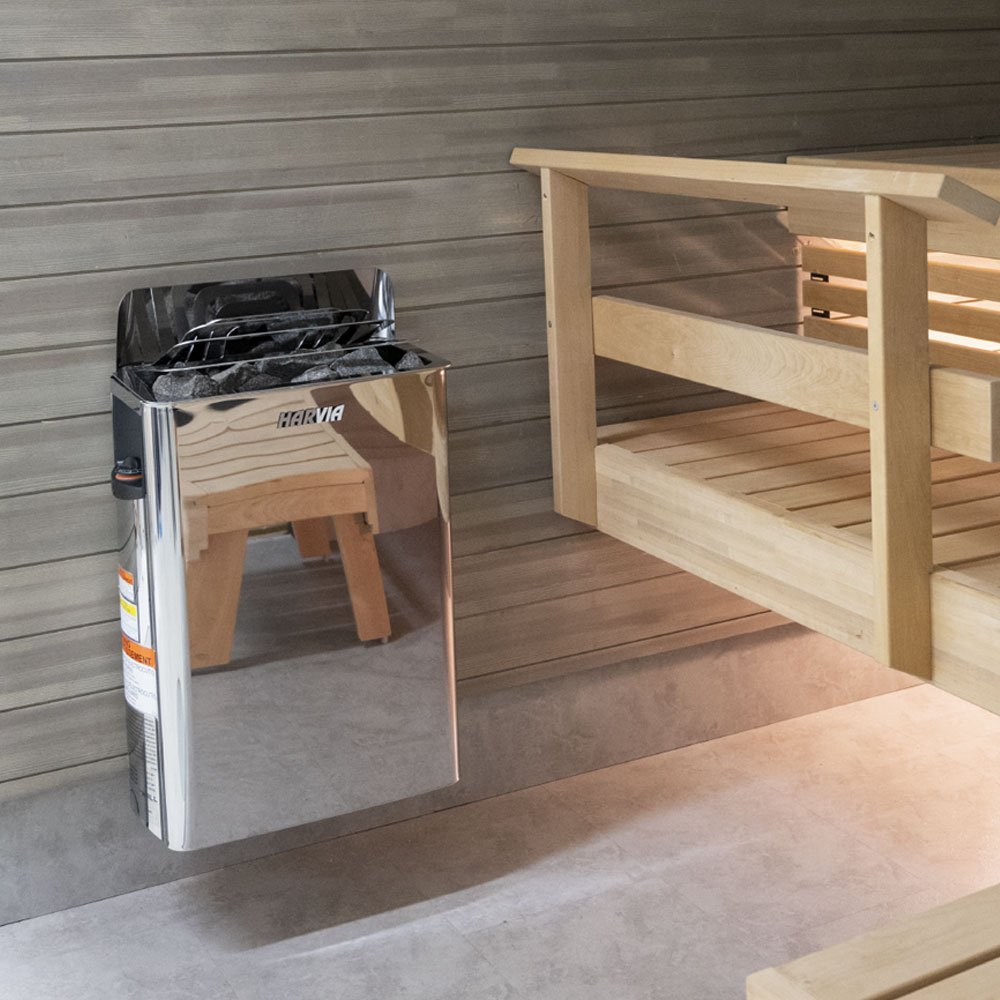 Harvia The Wall stainless steel heater mounted on a sauna wall