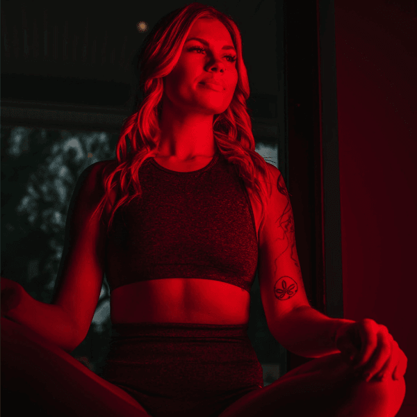 Woman using red light therapy