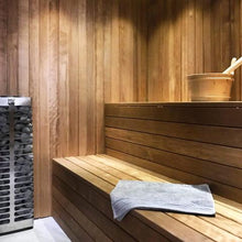 Load image into Gallery viewer, Huum Steel Mini 3.5kw Electric Sauna Heater in a sauna
